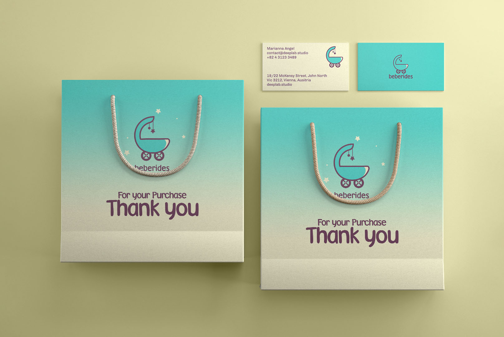 Heberides baby brand identity applied to shopping bags and business cards